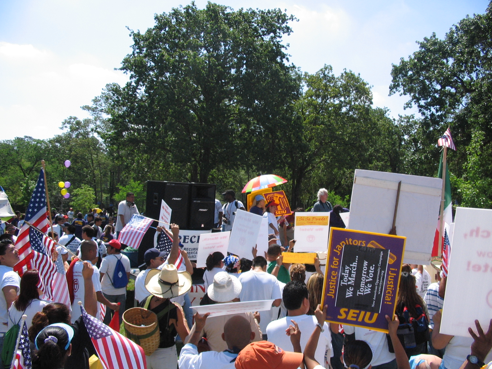 A day without immigrants - protesters, justice for janitors, flags